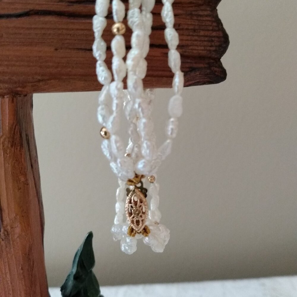 Solid 14k gold ,genuine pearl bracelet.